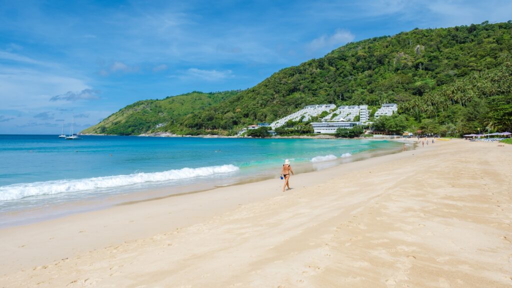 Nai Han beach Phuket Thailand, tropical beach with white sand and beach beds in Thailand Phuket Nai